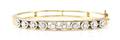A 14 Karat Yellow Gold and Diamond Bangle Bracelet