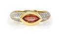 An 18 Karat Yellow Gold Orange Sapphire and Diamond Ring