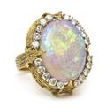 An 18 Karat Yellow Gold Opal and Diamond Ring