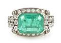 An Art Deco Platinum Emerald and Diamond Ring