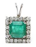 A 14 Karat White Gold Emerald and Diamond Pendant