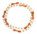 A 14 Karat Yellow Gold and Coral Bead Necklace