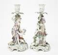 A Pair of Continental Porcelain Figural Candlesticks