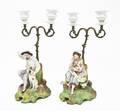 A Pair of Continental Bisque TwoLight Figural Candelabra