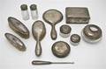 An American Sterling Silver Mounted Eleven Piece Dresser Set