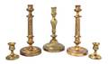 A Collection of Five Brass Candlesticks