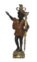 A Patinated and Gilt Metal Figural Candlestick