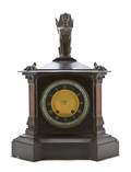 An Egyptian Revival Slate and Cast Metal Mantle Clock