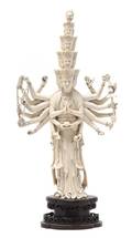 A Southeast Asian Carved Ivory Figure of a Deity