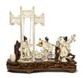 A Carved Ivory Figural Group