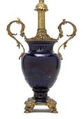 A Continental Porcelain and Gilt Metal Mounted Vase