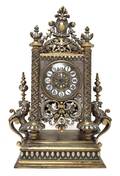 A Cast Metal and Parcel Gilt Mantel Clock