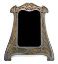 An Art Nouveau Pewter Mounted Mirror