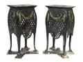 A Pair of Painted Iron Stands