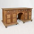 An Anglo Indian Teak and Rosewood Pedestal Desk