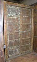A North Indian Iron Mounted Teak Paneled Double Door with Jamb