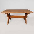A Scandinavian Country Pine Sawbuck Trestle Table