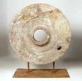 A Stone Grinding Wheel on Stand