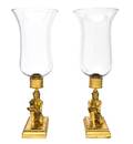 A Pair of Egyptian Revival Brass Candlesticks
