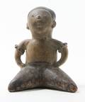 A PreColumbian Style Pottery Figure