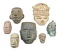 A Collection of Thirteen PreColumbian Style Carved Stone Masks