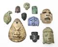 A Collection of TwentyTwo PreColumbian Style Carved Stone Mask Pendants