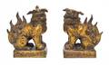 A Pair of Gilt Bronze Fu Dogs