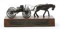 A Cast Bronze Sculpture of a Horse and Cart