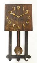 An Arts and Crafts Oak Wall Clock