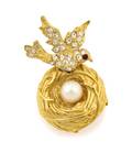 An Anne Caviness Bird Nest Brooch