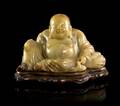 A Chinese Carved Soapstone or Steatite Model of Buddha