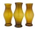 A Set of Three Amber Glass Hurricane Shades