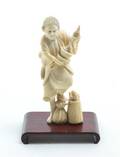 A Japanese Okimono Carved Ivory Figure