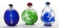 A Group of Three Peking Glass Overlay Snuff Bottles