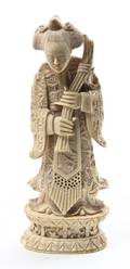 A Carved Ivory Figure of a Woman