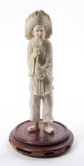 A Chinese Carved Ivory Figure of a Peasant