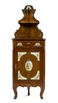 A German Burlwood and Porcelain Mounted Corner Cabinet