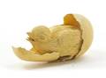 A Carved Ivory Hatching Chicken Egg