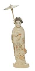 A Japanese Ivory Okimono of a Lady