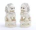 A Pair of Chinese Carved Ivory Fu Dogs