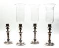 A Set of Four English Silverplate Candlesticks