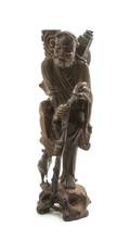 A Chinese Carved Wood Figure of an Ascetic