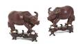 A Pair of Stained Ivory Water Buffalos