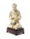 A Chinese Carved Ivory Figure of a Fruit Seller