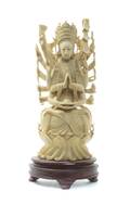 A SinoTibetan Carved Ivory Figure of an EighteenArmed Deity
