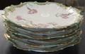A Set of Six Limoges Porcelain Plates Ovington Brothers