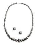 A Navajo Graduated Tooled Bead Necklace with Matching Earrings