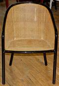 A Pair of Ebonized and Caned Arm Chairs