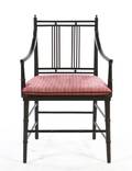 An Arts and Crafts Style Ebonized Open Armchair
