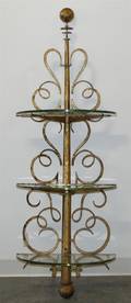 A Gilt Metal Wall Mounted Etagere
